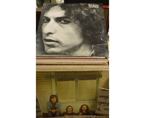 A box of various LP records including Bob Dylan "Hard Rain", "Pat Garrett & Billy The Kid", "John Wesley Harding", Them "Bad 