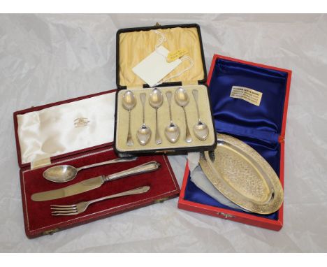 A cased set of six silver teaspoons (Birmingham 1895) together with a cased Christening set comprising silver spoon, fork and