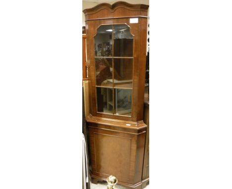 A corner display cabinet with astragal glazed door above a cupboard door, a mahogany and carved tilt top table on turned supp