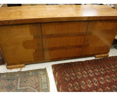 A 20th Century sideboard with pull-out marble slide above cupboard doors to bracket feet