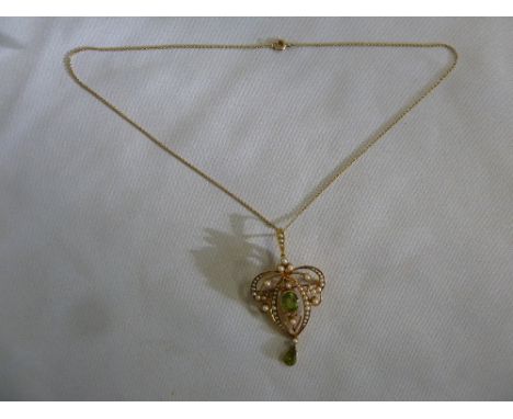 15ct gold seed pearl and tourmaline pendant on a 15ct gold chain, approx weight 10.5g
