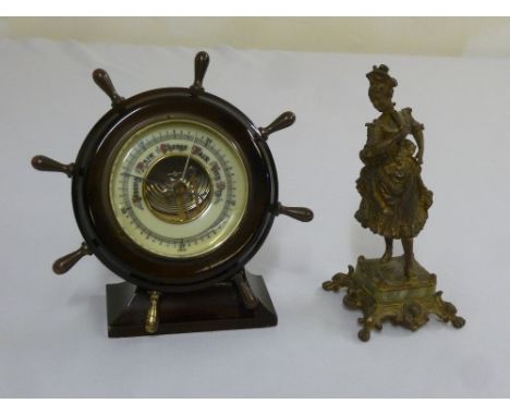 Victorian style ships wheel barometer on raised rectangular base and a gilt metal figurine