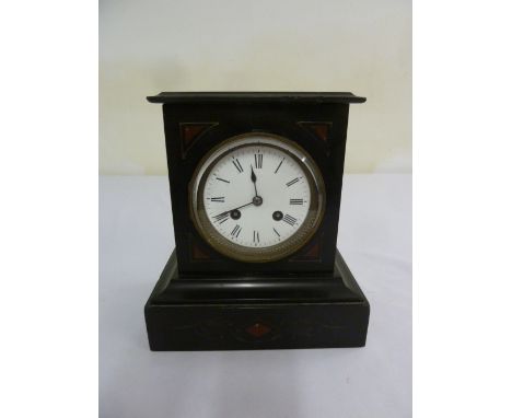 Black slate mantle clock with white enamel dial two train movement
