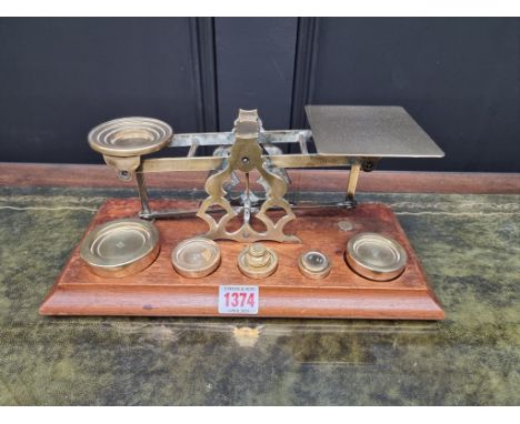 A good set of mahogany and brass postage scales, by S Mordan &amp; Co, with weights, 31.5cm wide.&nbsp; 