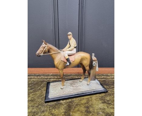 A novelty cold painted spelter horse and jockey table lighter,&nbsp;17cm high.&nbsp; 
