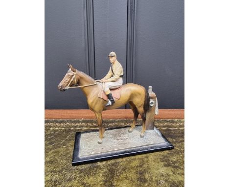 A novelty cold painted spelter horse and jockey table lighter,&nbsp;17cm high.&nbsp; 