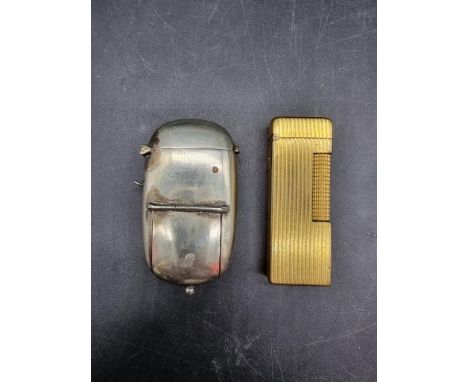 A plated metal combined vesta and sovereign case,&nbsp;further enclosing a toothpick and pencil; together with a Dunhill gilt