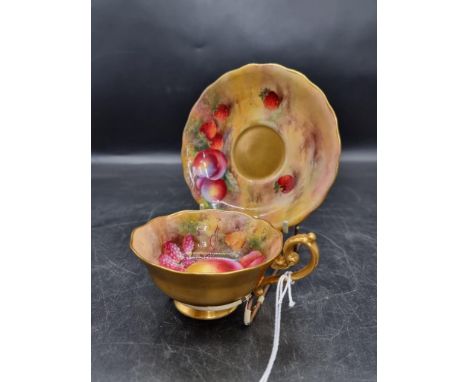 A Royal Worcester fruit painted cabinet cup and saucer,&nbsp;circa 1926, the cup painted by H G Moseley, the saucer by E Town