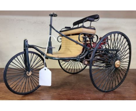 A scale model of an 1886 Benz Motorwagon,&nbsp;possibly Franklin Mint.&nbsp; 