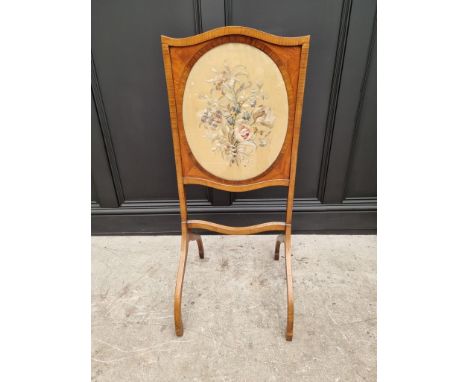 A late 18th century style mahogany, satinwood and rosewood firescreen, with needlework panel, 96cm high x 40cm wide. 