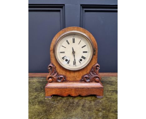 A late 19th century walnut dome top mantel clock, by W &amp; H, 28cm high, with pendulum. 