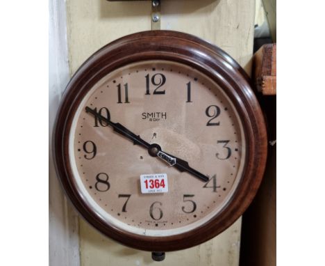 A vintage Smith brown Bakelite wall clock, 29cm diameter.&nbsp; 