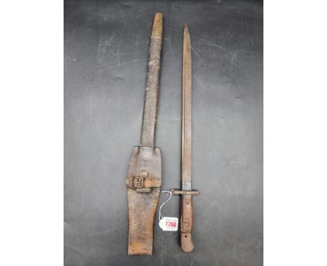 A British World War I pattern 1907 Lee Enfield sword bayonet and leather scabbard, stamped Wilkinson, with 43cm blade and lea