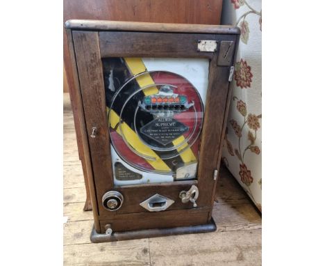 A vintage Allwin Supreme 'Penny In Slot' machine, 69.5cm high. 