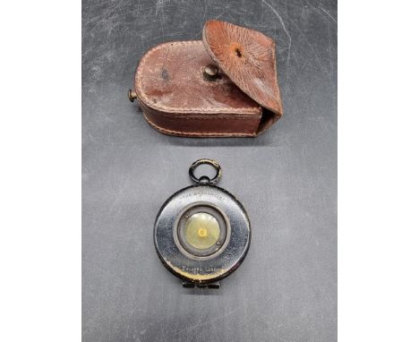A World War I period Dollond 'The Magnapole' brass pocket compass,&nbsp;in leather case.&nbsp; 