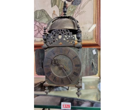 A 17th century brass lantern clock, the 5 7/8in chapter ring inscribed 'Nicholas Coxeter, London Fecit', 40cm high, (converte