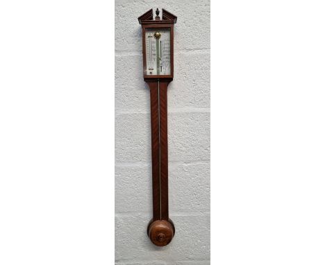 A reproduction mahogany stick barometer.&nbsp; 