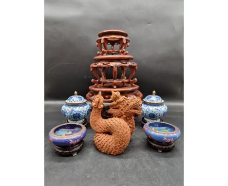 A small collection of Chinese items,&nbsp;to include a graduated set of three hardwood stands; and cloisonne enamel.&nbsp; 