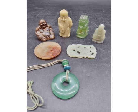 A small collection of Chinese jade and soapstone; together with a metal Buddha. (7) 