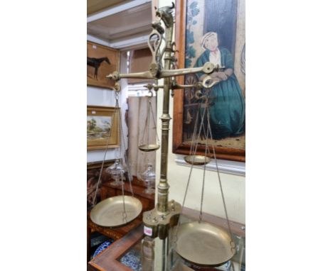 A large and unusual set of brass balance scales, with weights, 66.5cm high.  