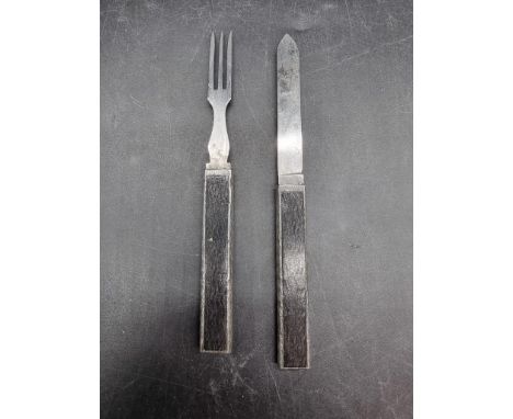 A 19th century white and ebony travelling knife and fork,&nbsp;the blade inscribed 'Dodworth', conjoined length 15cm.&nbsp; 