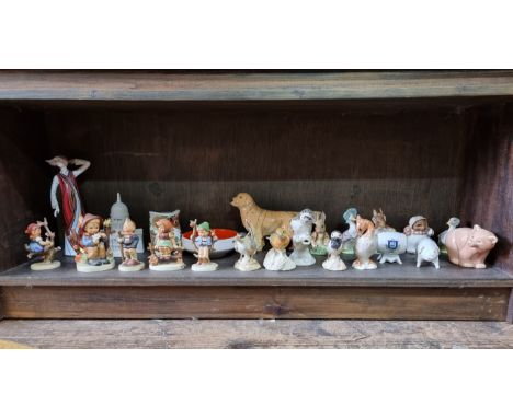 A collection of ceramic figures and similar, to include: examples by Royal Crown Derby; Beswick; Hummel; and Poole.&nbsp; 