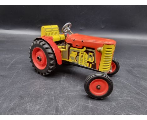 A tinplate clockwork tractor.&nbsp; 