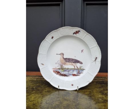 A 19th century Meissen plate, painted with a wading bird and insects, with basketweave boarder, 24.5cm diameter, (s.d.). 