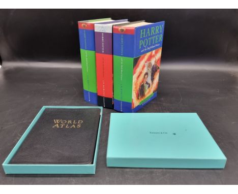 Books: a Tiffany &amp; Co leather bound world atlas, 4to, boxed; together with three Harry Potter first edition hardback publ