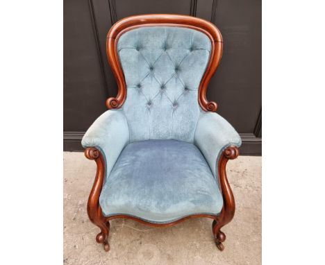 A Victorian mahogany and button upholstered occasional armchair.&nbsp; 