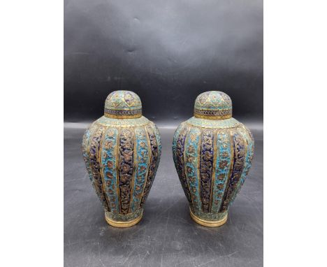 A pair of Kashmir enamel ovoid vases and covers, 19th century, 16cm high. 