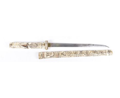 A Japanese Tanto, late 19th early 20th Century 
The 13 inch blade, with carved bone scabbard and handle with stained depictio