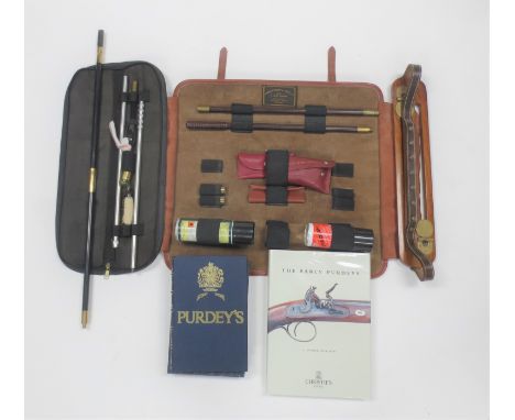 Purdey shooting accessoriesComprising:-A J. Purdey cleaning kit in a leather folding case, some pieces missingA J. Purdey 2-p