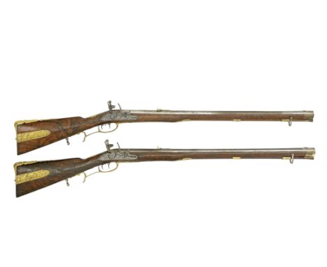 A Pair Of Bohemian .577 (25-Bore) Flintlock Ormolu-Mounted Sporting RiflesBy G.E. Peter Of Carlsbad, Early 18th CenturyWith o