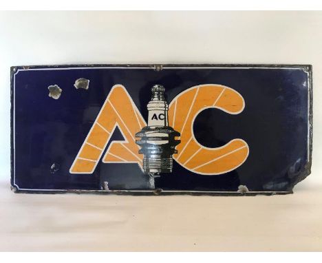 An AC plugs rectangular enamel sign with central plug motif, 21 x 9".
