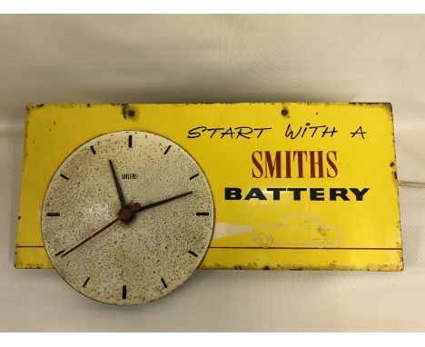 A Smiths Battery wall clock, electrically powered, 18 x 9 1/2".