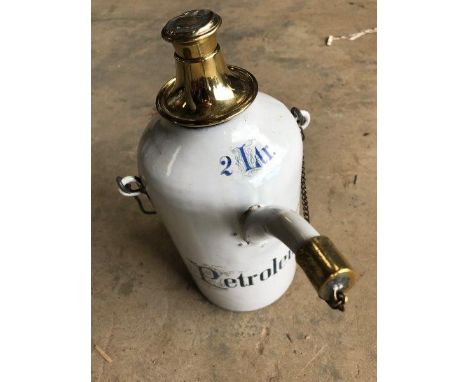 A two litre Petroleum white enamel and brass mounted priming kettle. 