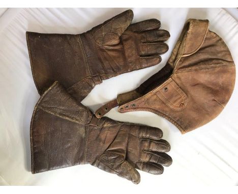 A Ledux leather racing driver's helmet and a pair of Duphine wool lined leather driving gauntlets.