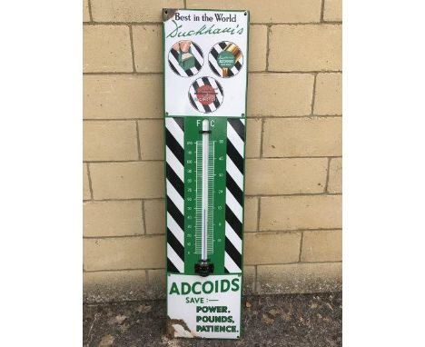 A Duckham's Adcoids black and white enamel thermometer with good colour, 11 x 45 1/2".