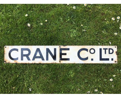 A rectangular enamel sign - Crane Co. Limited, 35 x 5 1/2".