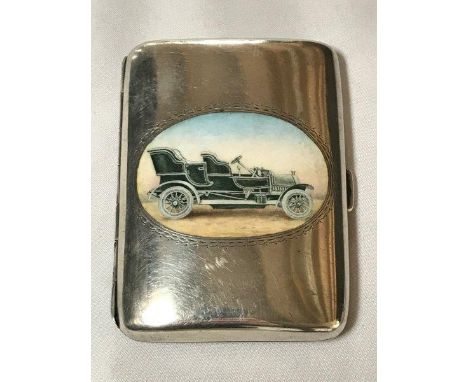 A rare silver cigarette case with oval enamel centre depicting an Edwardian motor car, engraved to the other side a dedicatio