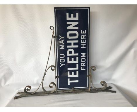 A 'You may telephone from here' double sided enamel sign on metal bracket, the enamel in excellent condition to both sides.