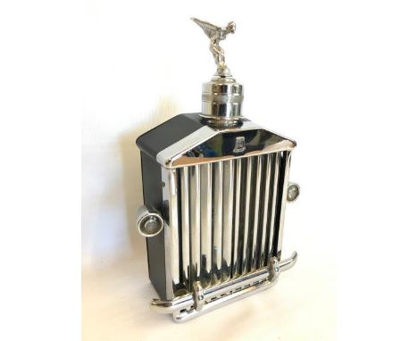 A musical decanter in the shape of a Rolls-Royce radiator.