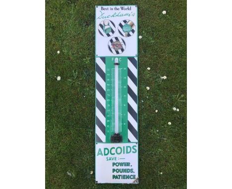 A Duckham's Adcoids black and white enamel thermometer with slight fading, 11 x 45 1/2".