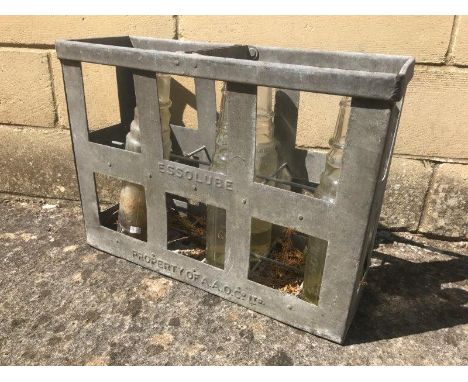 An Essolube 12 bottle crate containing five Esso oil bottles.