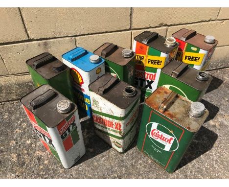 Nine one gallon cans including BP and Castrol. 