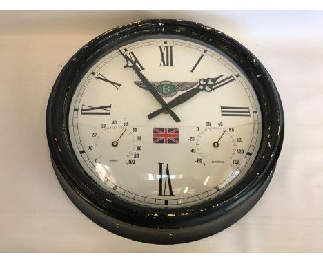 A decorative showroom wall clock with Bentley decal and additional gauges to the dial for humidity and temperature.
