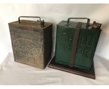 An Esso two gallon petrol can with Pratts cap and a Shell Motor Spirit two gallon petrol can on running board bracket.