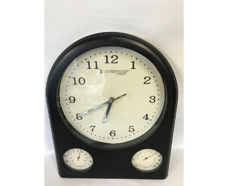 A decorative wall clock with Dunlop advertising and integral thermometer and hygrometer.