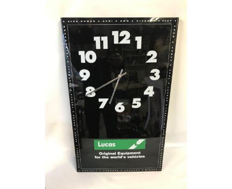 A Lucas Dealership wall clock, 14 1/2 x 24".